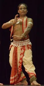 Guru Pradhanta An Odissi dancer performing against Austin's cityscape