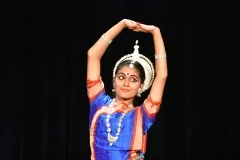 An Odissi dancer forming a delicate mudra with her hands